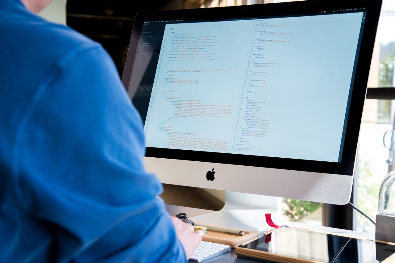 Business professional reviewing up-to-date cybersecurity measures on their computer, reflecting Islands Insurance's focus on staying current with ' Are you up to date ' guidance.